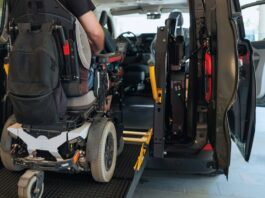 Top Features Families Love in Mobility Vehicles Someone in a powered wheelchair uses a rear-entry ramp to get into a vehicle. The passenger door is also open.